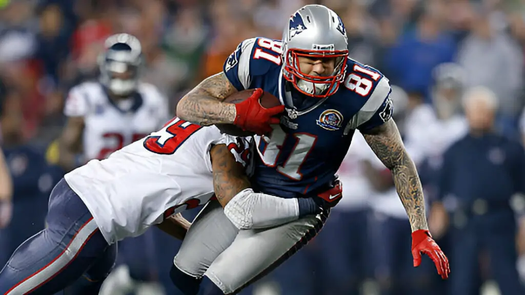 New England Patriots tight end Aaron Hernandez gains yardage in the fourth quarter against the Houston Texans