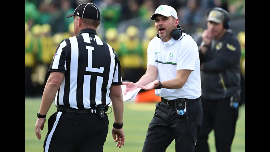 Former Oregon Ducks head coach Mark Helfrich has some words with an official during the second quarter of the game against the Stanford Cardinal