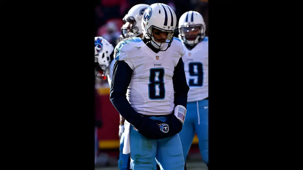 Tennessee Titans quarterback Marcus Mariota walks off the field during a timeout in the game against the Kansas City Chiefs