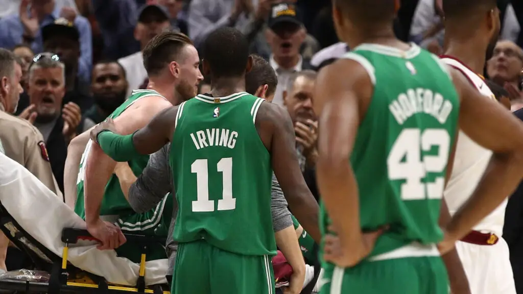 Boston Celtics star Kyrie Irving consoles Gordon Hayward after Hayward was injured while playing the Cleveland Cavaliers