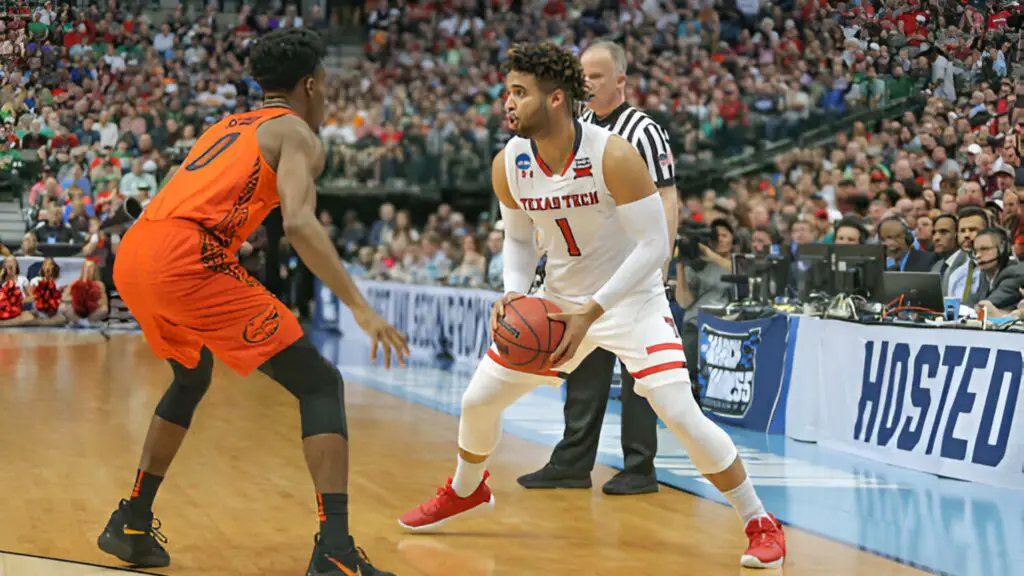 Texas Tech Red Raiders guard Brandone Francis looks to make a play against Mike Okauru against the Florida Gators during the NCAA Division I Men's Championship Second Round basketball game between Florida and Texas Tech