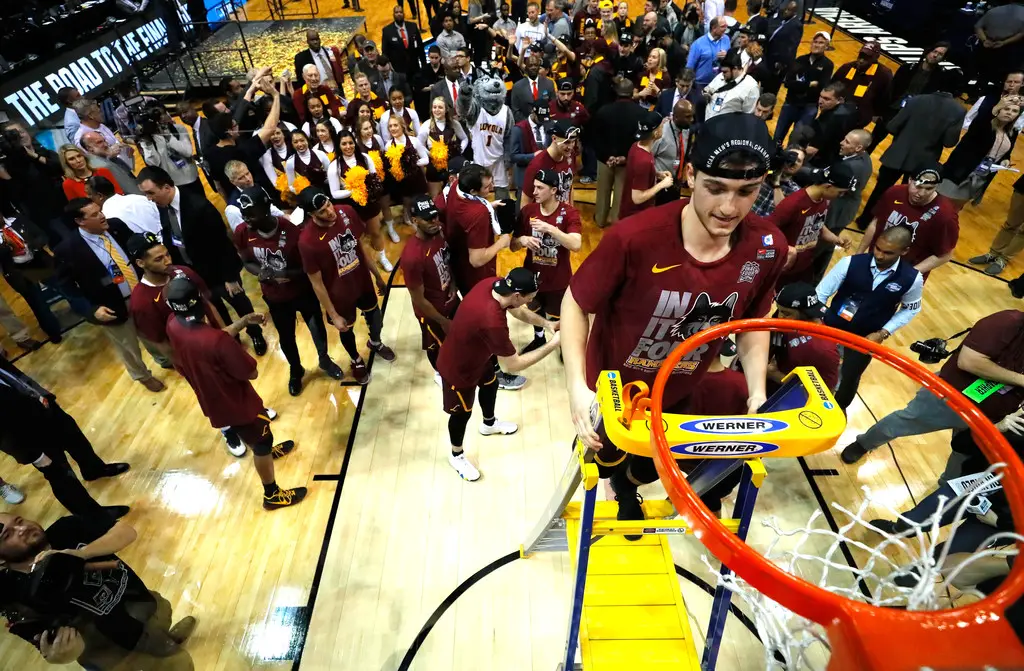 Clayton Custer is seen here cutting down the net after No. 11 seed Loyola-Chicago advanced to their second Final Four in program history (Getty Images)