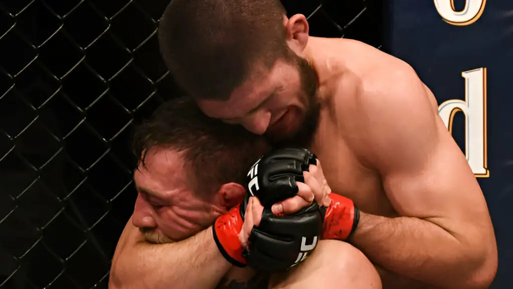 UFC star Khabib Nurmagomedov locks in a rear naked choke on Conor McGregor, resulting in a tap out, in their UFC lightweight championship fight during UFC 229