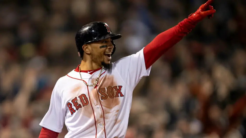 Boston Red Sox star Mookie Betts reacts as he scores during the first inning of game one of the 2018 World Series against the Los Angeles Dodgers