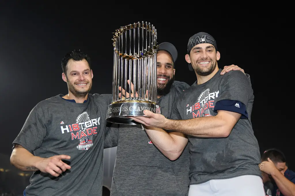 Boston Red Sox pitchers David Price, Nathan Eovaldi, and Joe Kelly with the World Series Trophy 