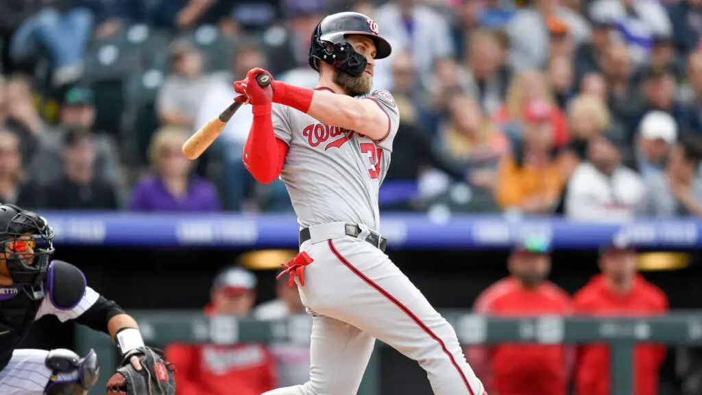 Washington Nationals star Bryce Harper hits a ninth-inning double against the Colorado Rockies