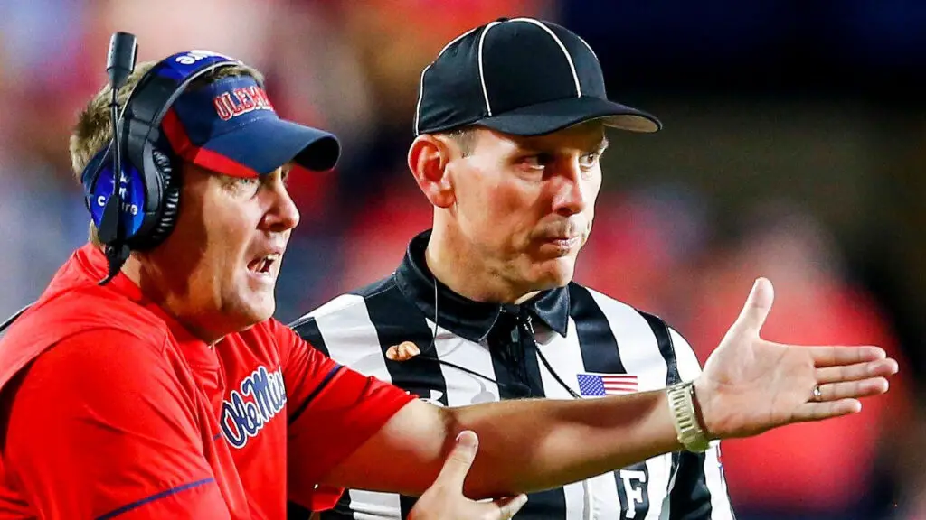 Former Mississippi Rebels head coach Hugh Freeze talks with a referee during the second half of an NCAA college football game against the Auburn Tigers