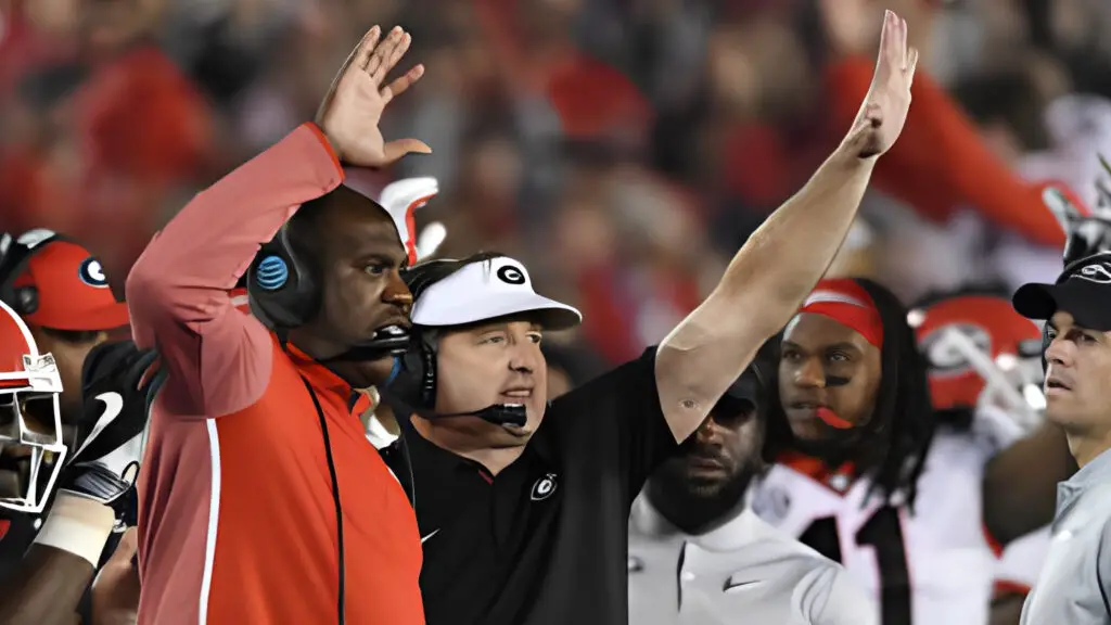 Georgia Bulldogs head coach Kirby Smart and defensive coordinator Mel Tucker raise their hands in gestures to their players during the 4th quarter of the College Football Playoff Semifinal at the Rose Bowl Game between the Georgia Bulldogs and Oklahoma Sooners