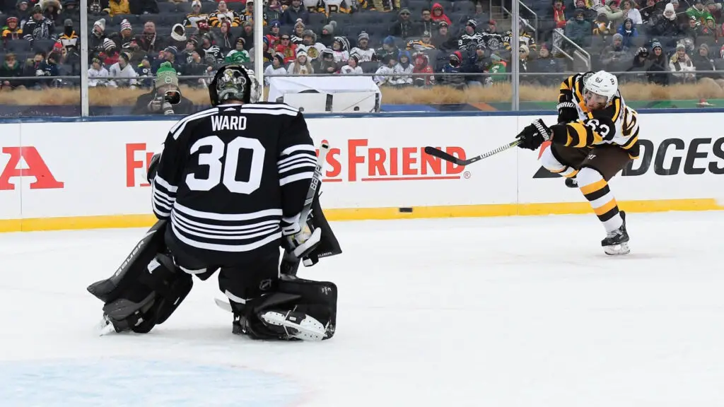 Boston Bruins player Brad Marchand shoots from the right wing during the 2019 Bridgestone NHL Winter Classic game against the Chicago Blackhawks