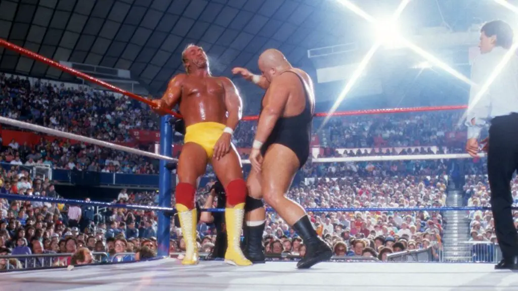 Former WWE Superstar King Kong Bundy delivers a chop to wrestling legend Hulk Hogan during their WrestleMania match