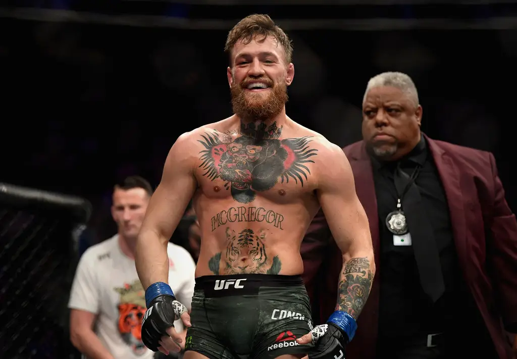 Retired MMA fighter Conor McGregor laughs after the first round against Khabib Nurmagomedov at UFC 229