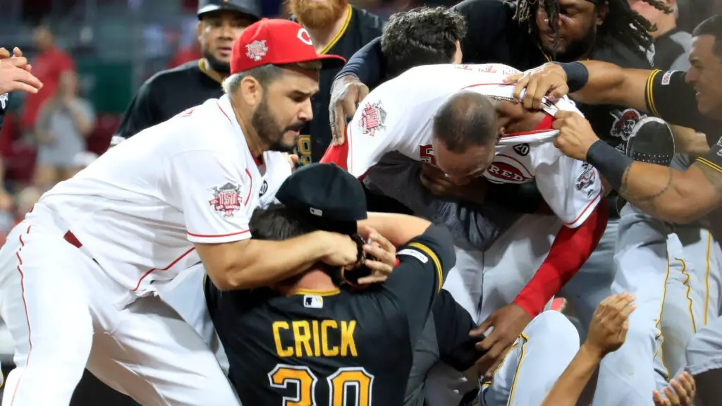 Cincinnati Reds player Amir Garrett (middle white shirt without hat) engages members of the Pittsburgh Pirates during a bench-clearing altercation in the 9th inning of the game