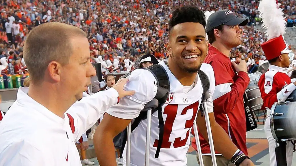 Alabama Crimson Tide quarterback Tua Tagovailoa stands on the sidelines during the final seconds of the first half against the Auburn Tigers