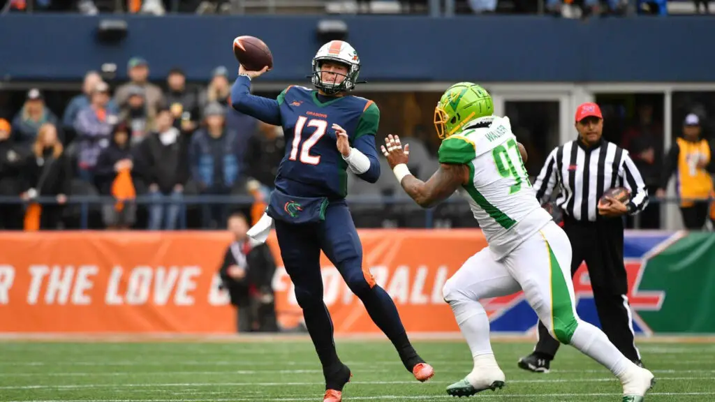 Seattle Dragons quarterback Brandon Silvers attempts to throw the football against the Tampa Bay Vipers