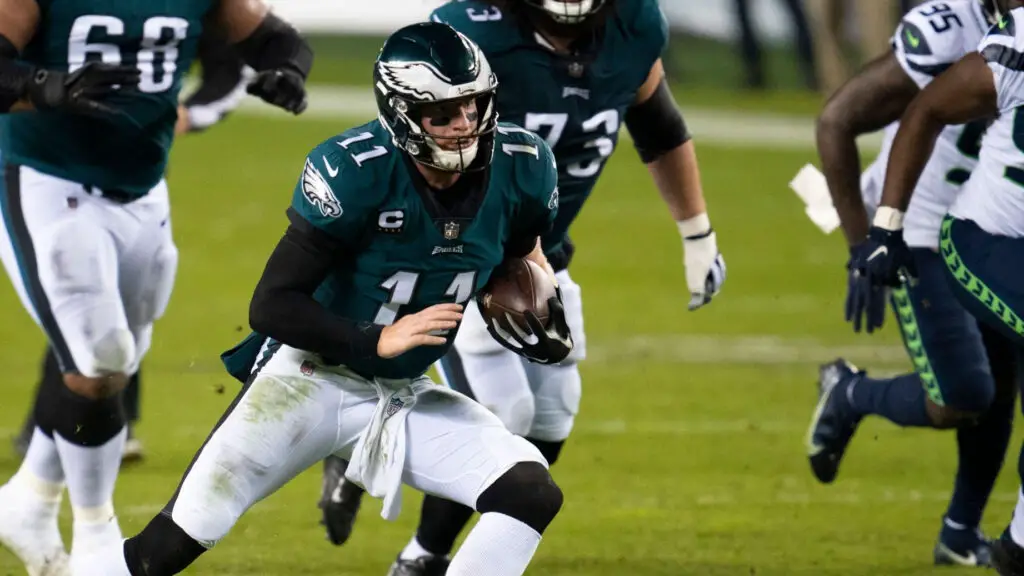 Philadelphia Eagles quarterback Carson Wentz runs with the football during an NFL game against the Seattle Seahawks