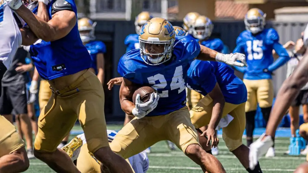 UCLA Bruins running back Zach Charbonnet carries the football in practice