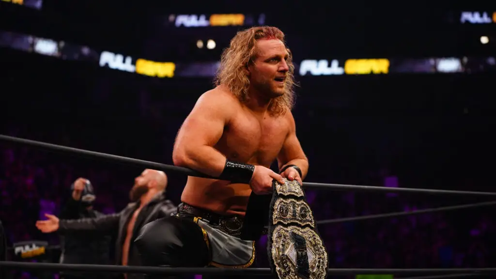 AEW wrestler "Hangman" Adam Page looks into the crowd after winning the AEW Championship at Full Gear