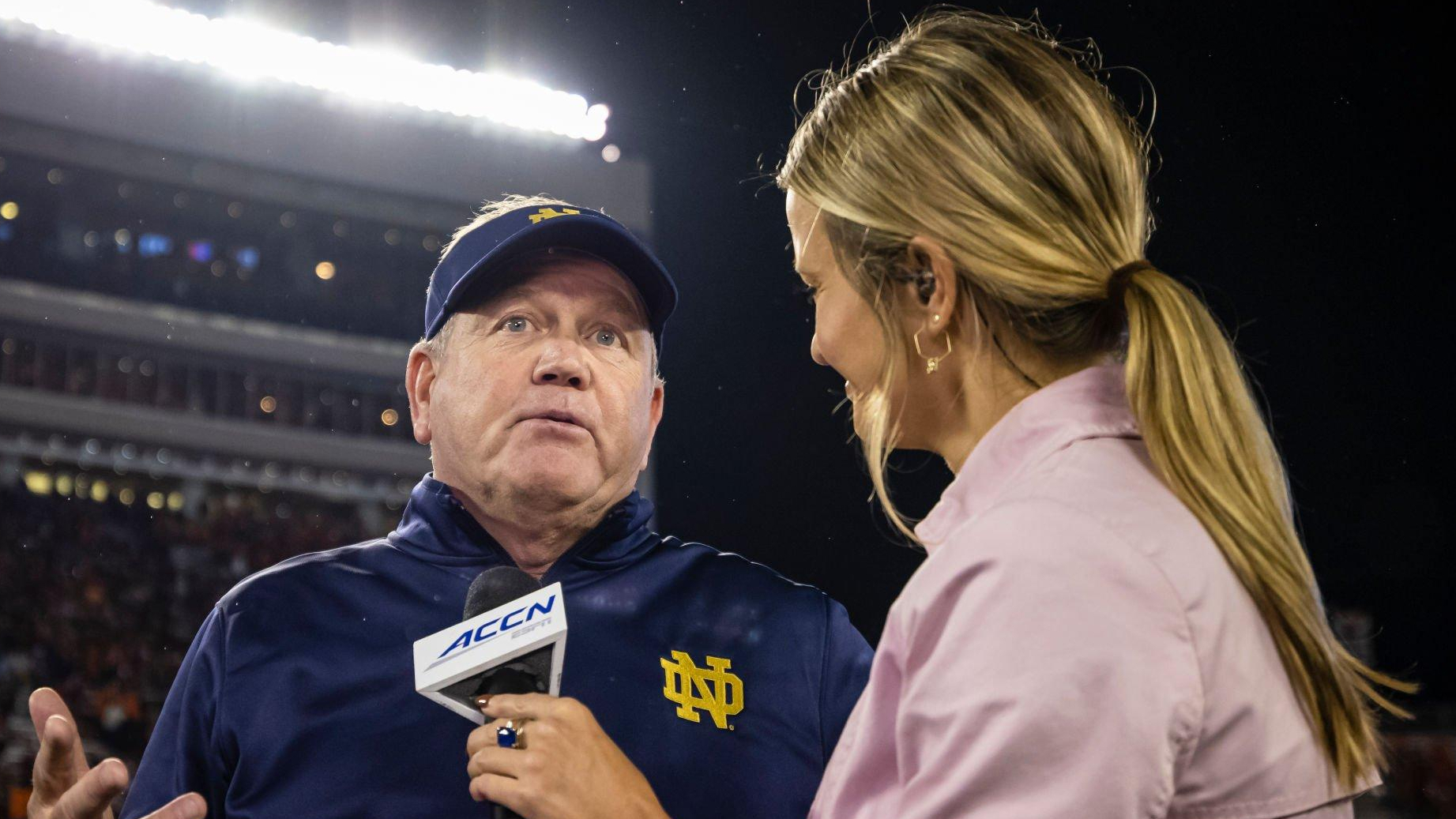 Former Notre Dame Fighting Irish head coach Brian Kelly is interviewed after the game against the Virginia Tech Hokies