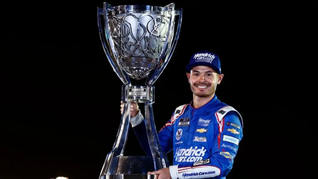 Hendrick Motorsports driver Kyle Larson holds the NASCAR Cup Series Championship trophy after winning the 2021 Championship