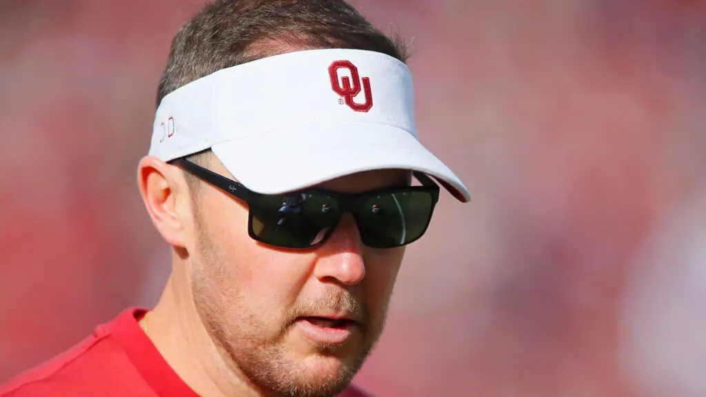 Former Oklahoma Sooners head coach Lincoln Riley greets players before a game against the Iowa State Cyclones