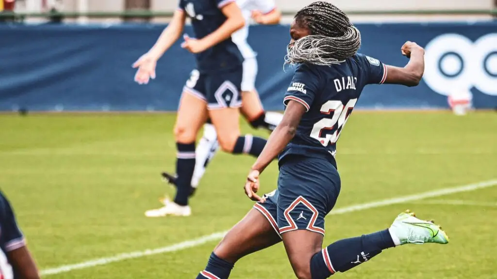 Paris Saint-Germain soccer player Aminata Diallo attempts to kick the ball against FC Fleury 