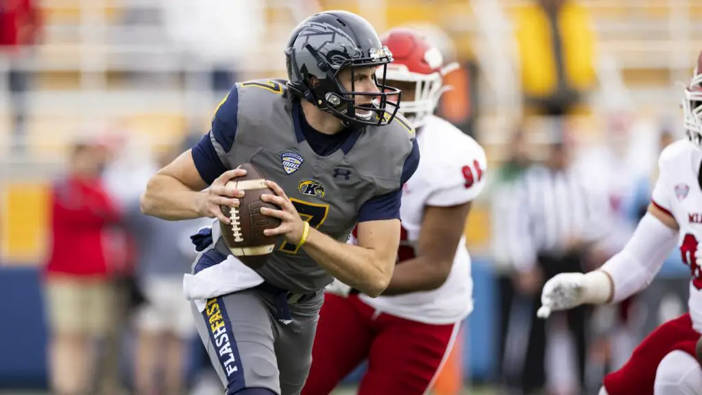 Kent State Golden Flashes quarterback Dustin Crum carries the football against the Miami (Ohio) RedHawks