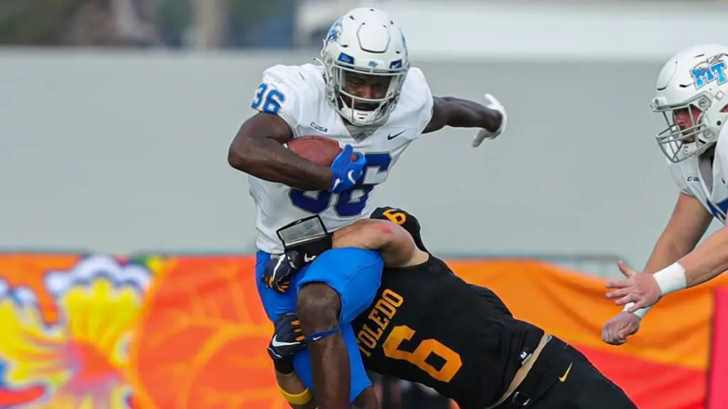 Middle Tennessee State Blue Raiders running back Frank Peasant carries the football against the Toledo Rockets in the 2021 Bahamas Bowl 