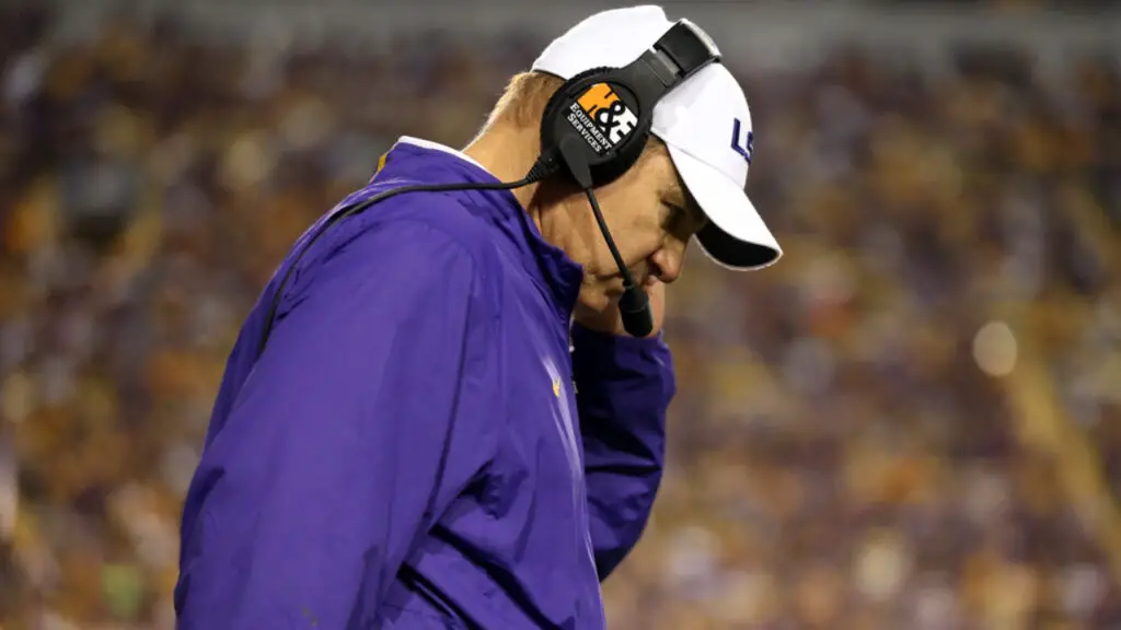 Former Kansas Jayhawks head coach Les Miles seen here as the LSU Tigers head coach is looking down after a play against the Texas A&M Aggies