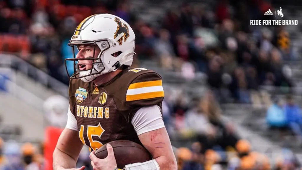Wyoming Cowboys quarterback Levi Williams carries the football against the Kent State Golden Flashes in the Famous Idaho Potato Bowl