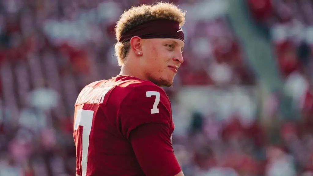 Former Oklahoma Sooners quarterback Spencer Rattler walks on the field before a game