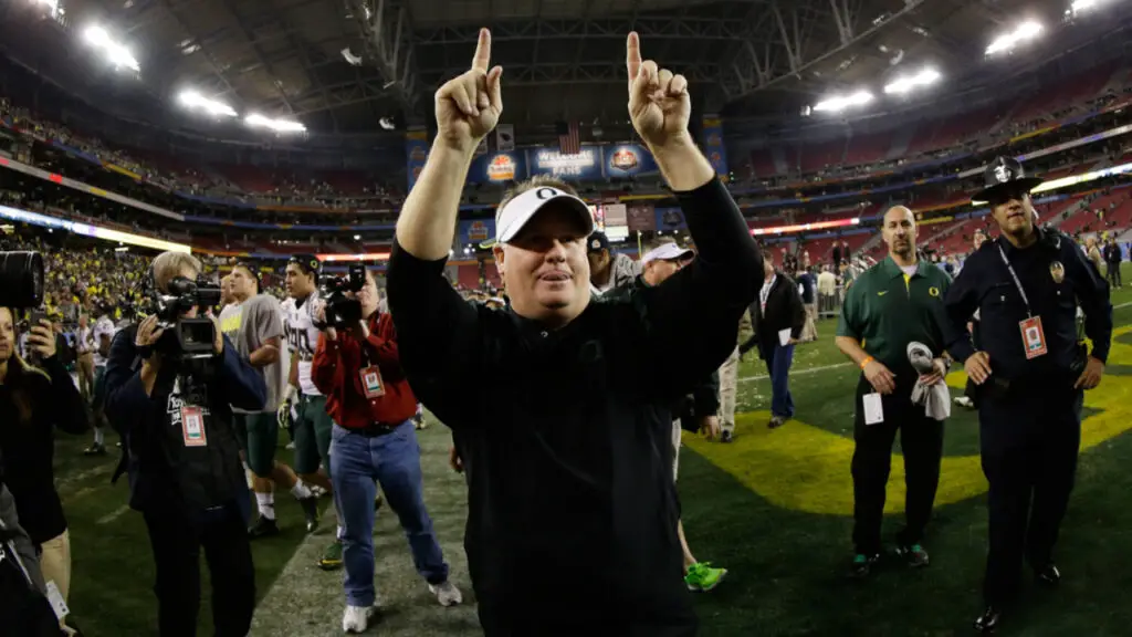 Former Oregon Ducks head coach Chip Kelly celebrates a 35-17 win over the Kansas State Wildcats in the Tostitos Fiesta Bowl