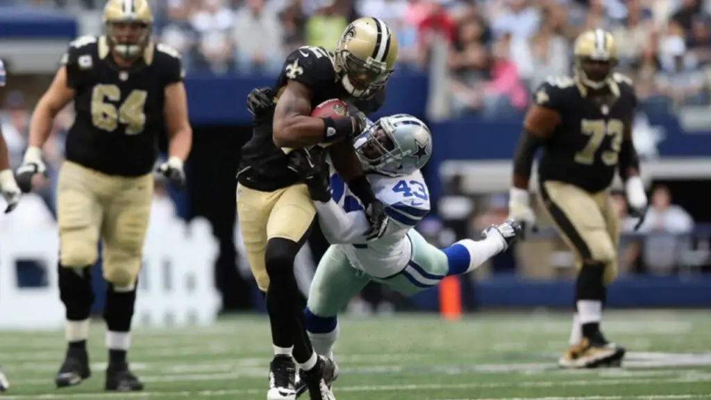 Former Dallas Cowboys defensive back Gerald Sensabaugh Jr. attempts to make a tackle against the New Orleans Saints