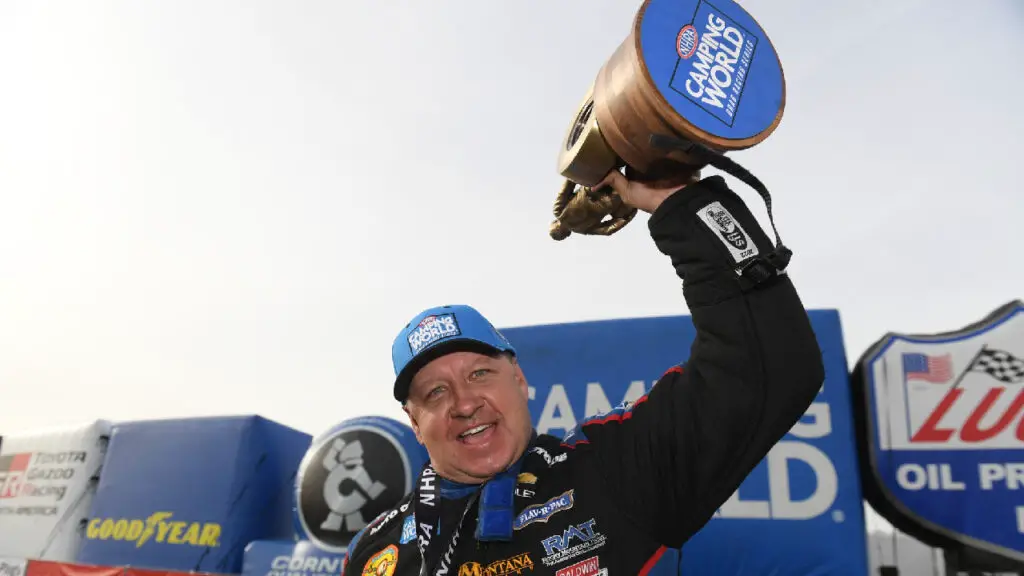 Auto Club of Southern California sponsored driver Robert Hight celebrates with the Wally after winning the NHRA Arizona Nationals