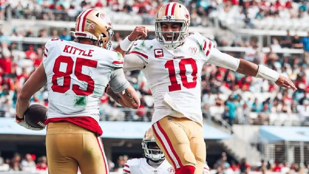San Francisco 49ers quarterback Jimmy Garoppolo celebrates with George Kittle after a touchdown