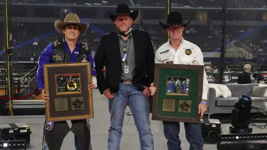 Professional Bull Riders president Sean Gleason stands with PBR Rookie of the Year Boudreaux Campbell and PBR Retiree Sean Willingham at the PBR World Finals