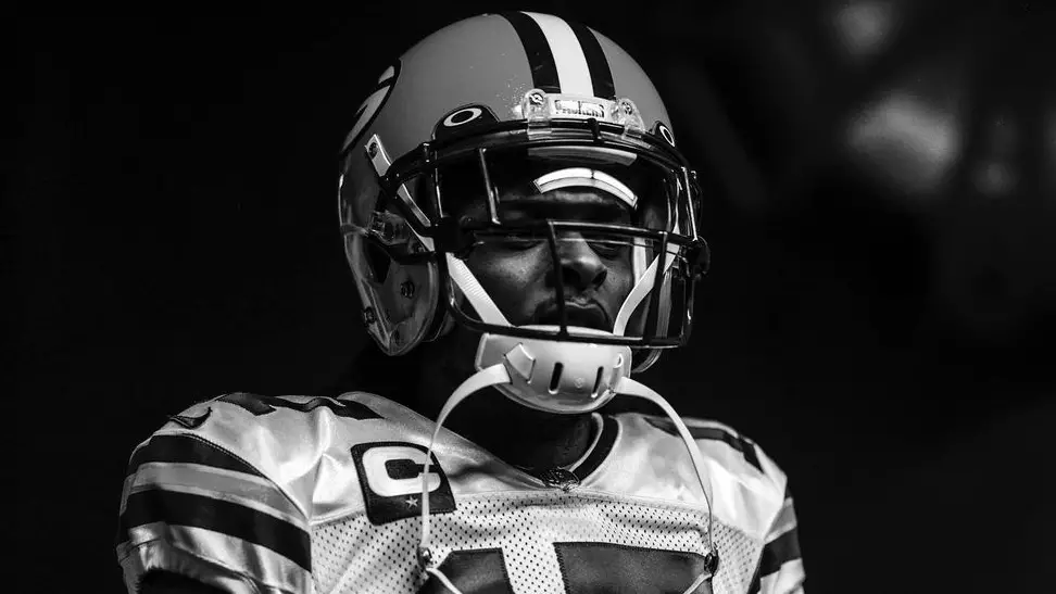 Former Green Bay Packers wide receiver Davante Adams looks on before a game