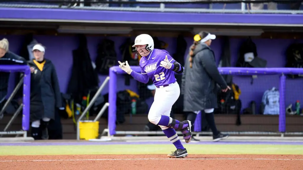 James Madison Dukes' softball player Lauren Bernett celebrates after a hit in a game