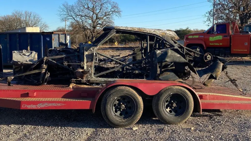 Street Outlaws star James “Reaper” Goad picks up one of his two cars that were involved in a stacker trailer fire following a No Prep Kings event