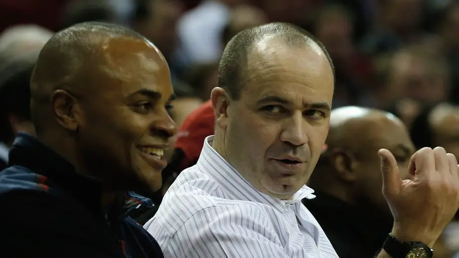 Houston Texans head coach Bill O'Brien sits alongside his general manager Rick Smith during a game between the Los Angeles Lakers and the Houston Rockets