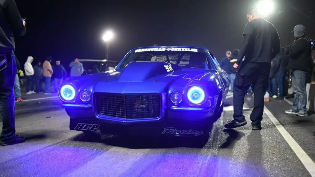 Drag Racer Eric Bain getting ready to drive Boosted Ego during a pass on the street 