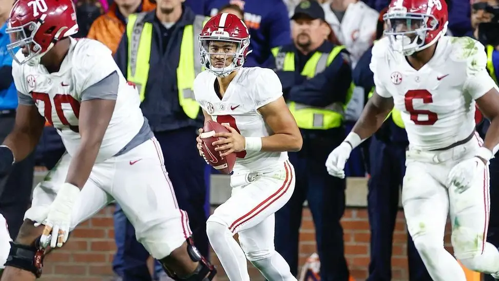 Alabama Crimson Tide quarterback Bryce Young drops back to throw a pass against the Auburn Tigers