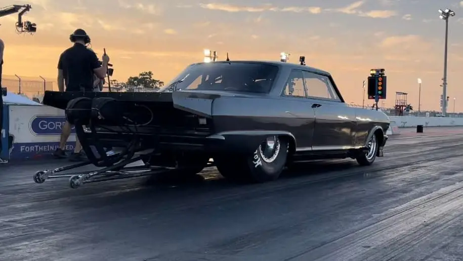 Street Outlaws star Daddy Dave Comstock is about to make a pass during the filming of the 2022 Street Outlaws No Prep Kings season-opener at Palm Beach International Raceway