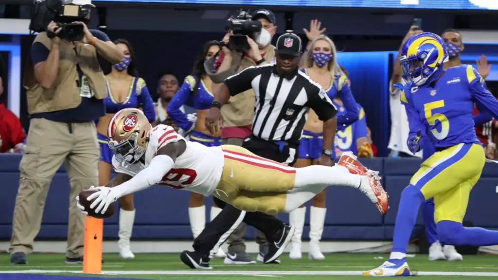 San Francisco 49ers wide receiver Deebo Samuel scores on a diving touchdown against the Los Angeles Rams
