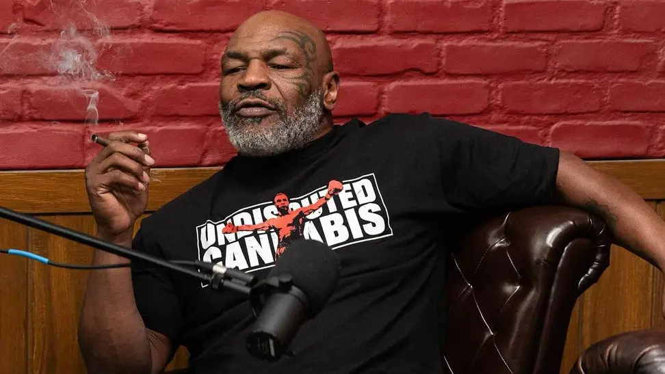Boxing legend Mike Tyson smokes weed during an appearance on a podcast