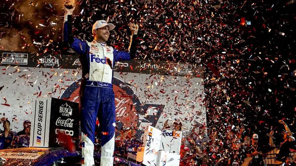 NASCAR Cup Series driver Denny Hamlin celebrates in Victory Lane at the Coca-Cola 600