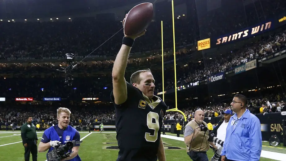 Former New Orleans Saints quarterback Drew Brees walks off the field after celebrating the NFC Wild Card playoff game win against the Carolina Panthers