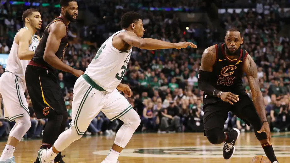 Boston Celtics guard Marcus Smart defends LeBron James as he drives to the basket against the Cleveland Cavaliers in the 2018 NBA Eastern Conference Finals