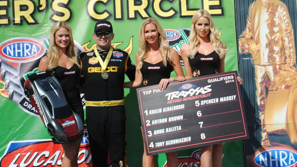 Geico Top Fuel Dragster driver Richie Crampton celebrating with the Traxxas women after winning his first race at Old Bridge Township Raceway Park