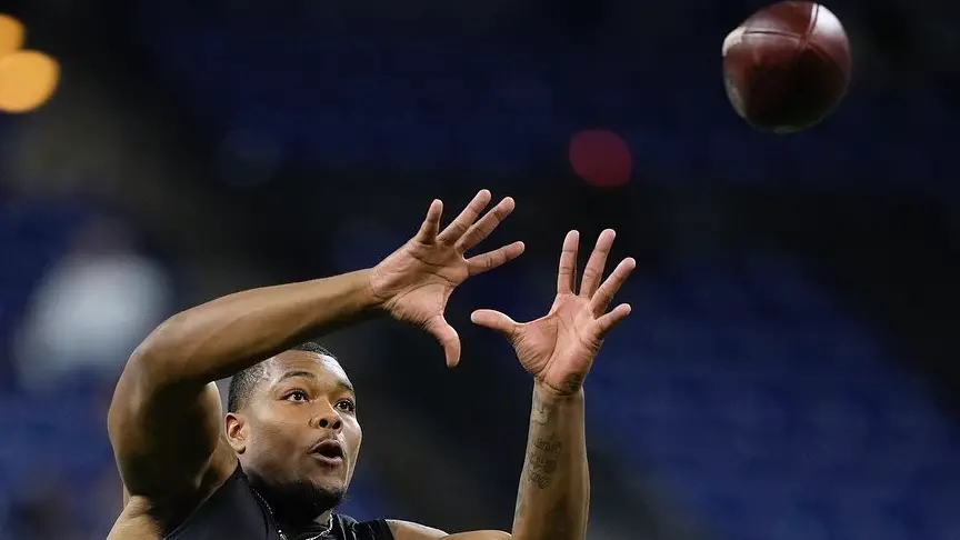 Former Georgia Bulldogs defensive lineman Travon Walker makes a reception during the NFL Combine at Lucas Oil Stadium