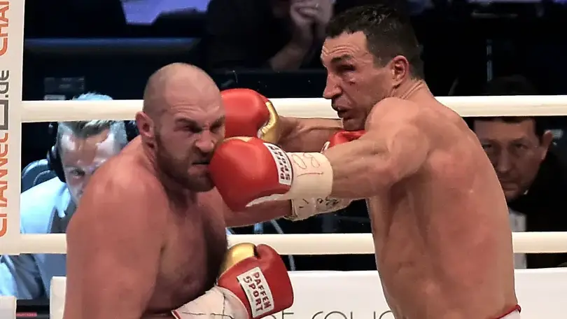Former Heavyweight Champion boxer Wladimir Klitschko punches Tyson Fury in the face during their heavyweight bout
